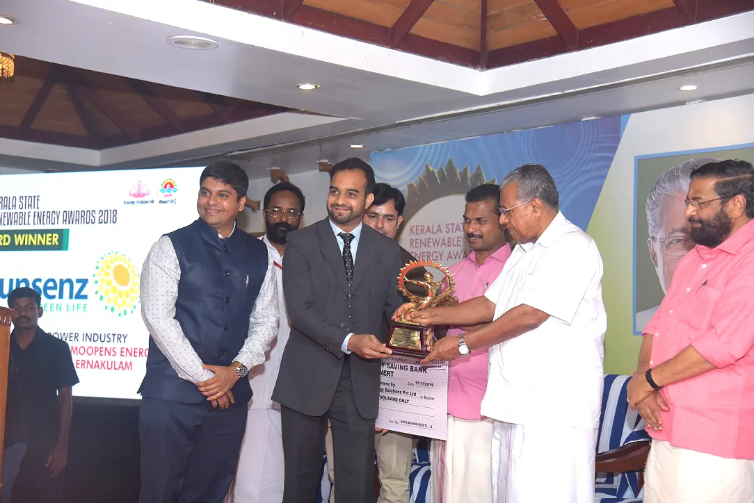 Moopens Energy is awarded the Best Solar Company in Kerala by Shri. Pinarayi Vijayan, Honourable Chief Minister of Kerala handing over the best solar company in Kerala award to Moopens Energy Solutions Pvt Ltd CEO Mohammed Fayaz Salam